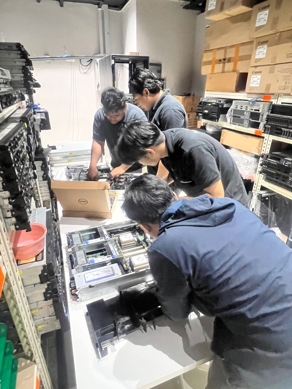 Technical team working on ICT equipment