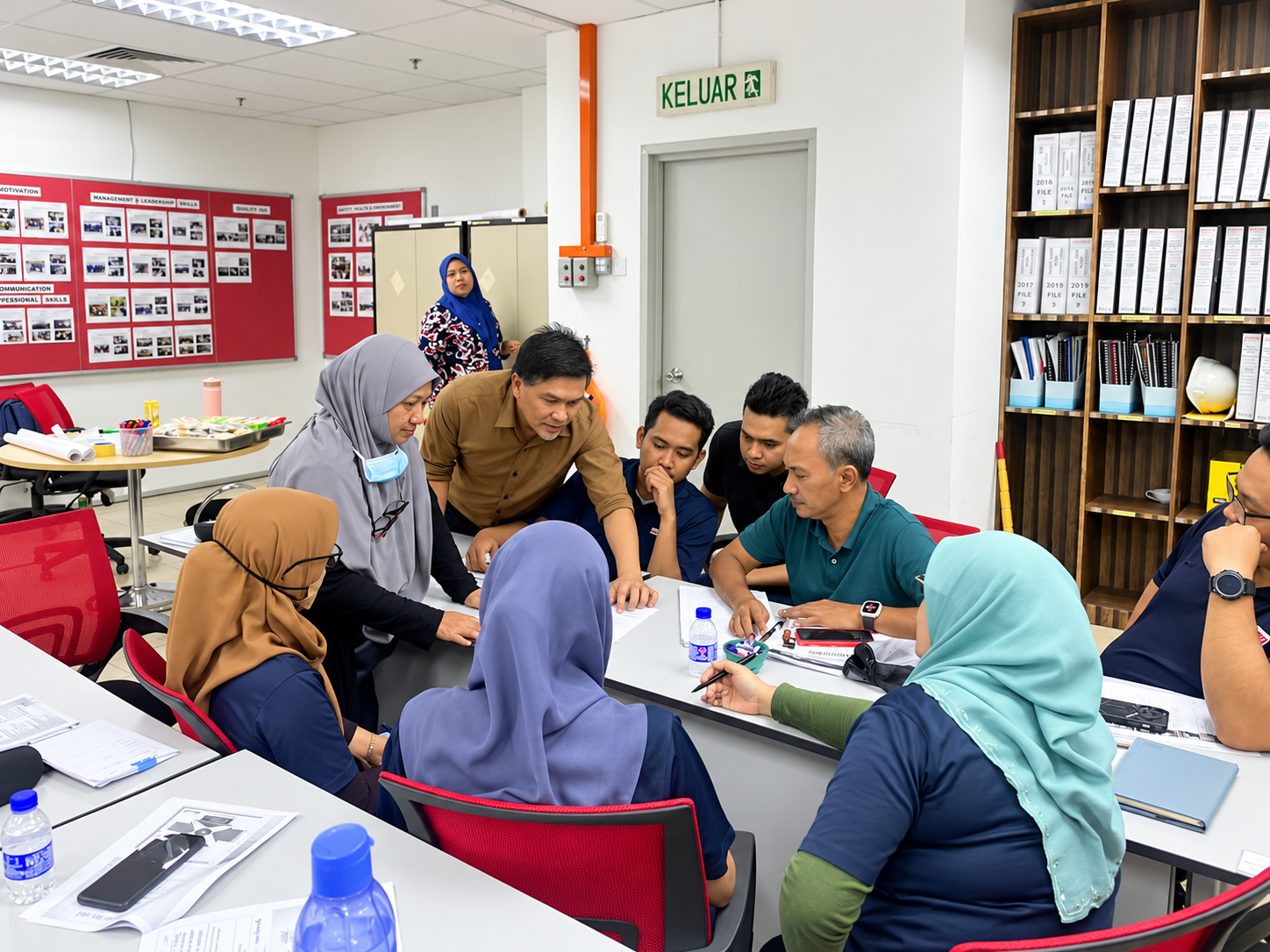 Participants completing a practical ISO workshop activity