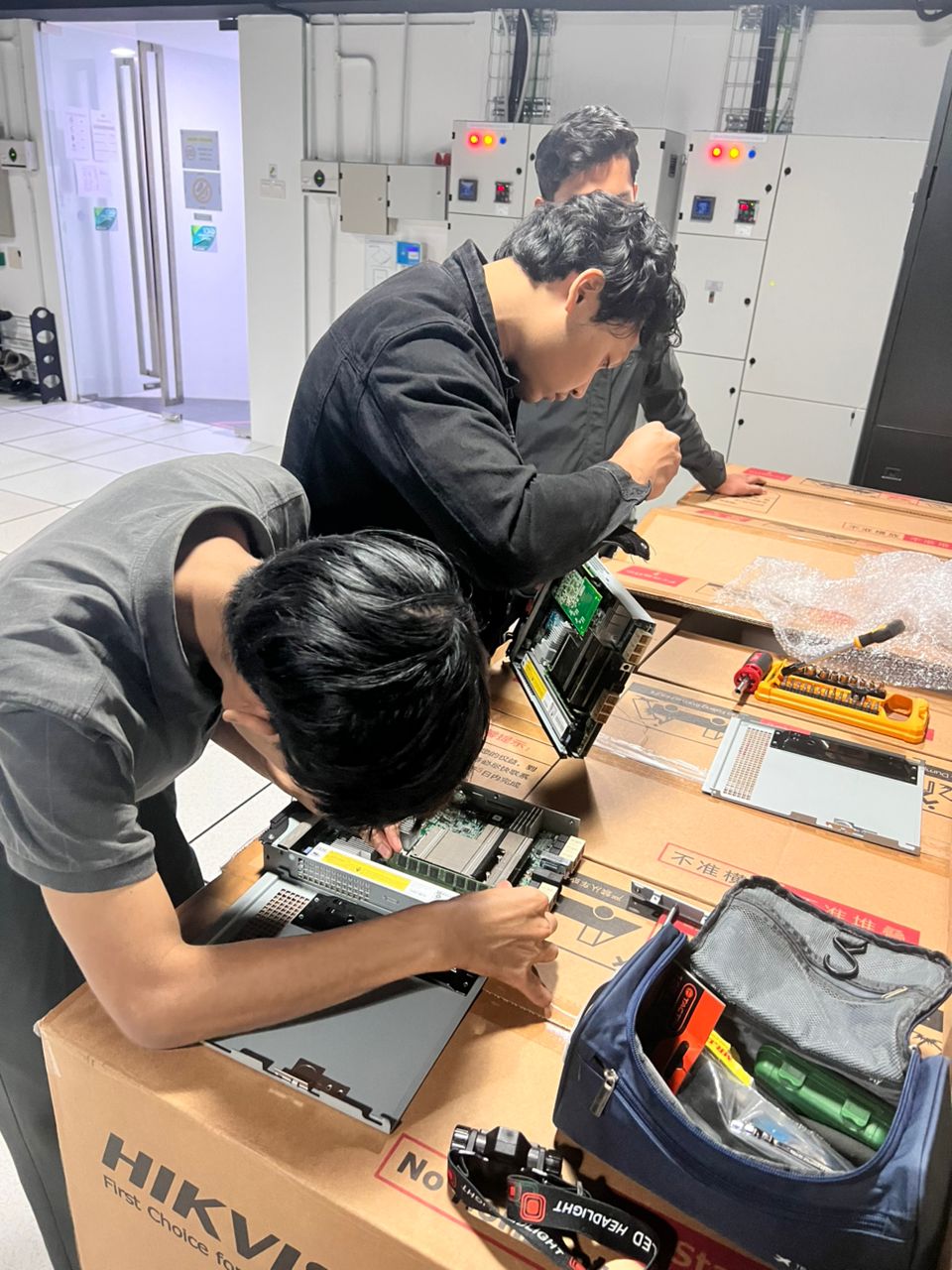 Crossroad technical team working together on IT equipment