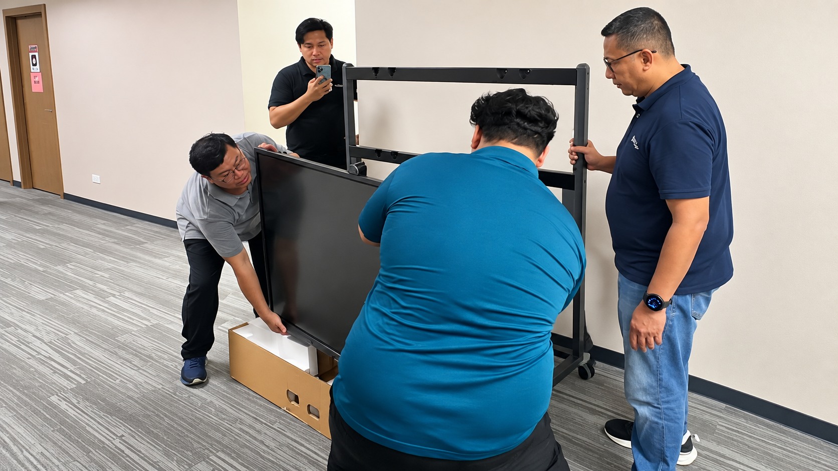 Team installing a presentation display