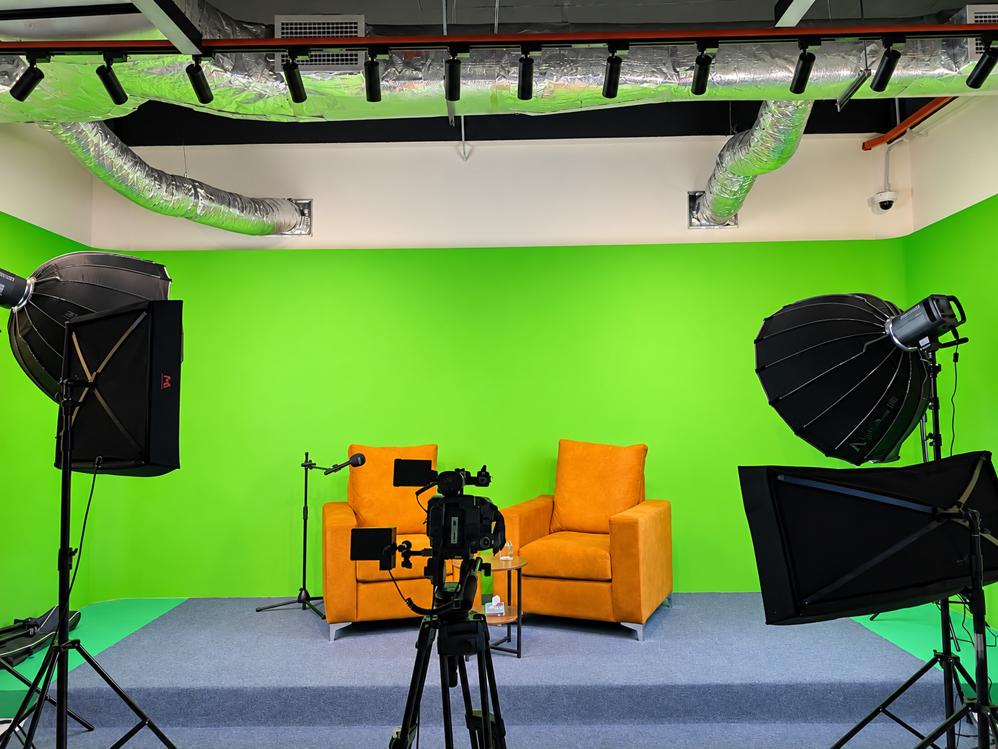 Completed content studio with cameras, lighting and green screen